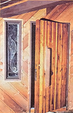 This etched glass sidelight and handmade door enhance the Lankford home's entry.